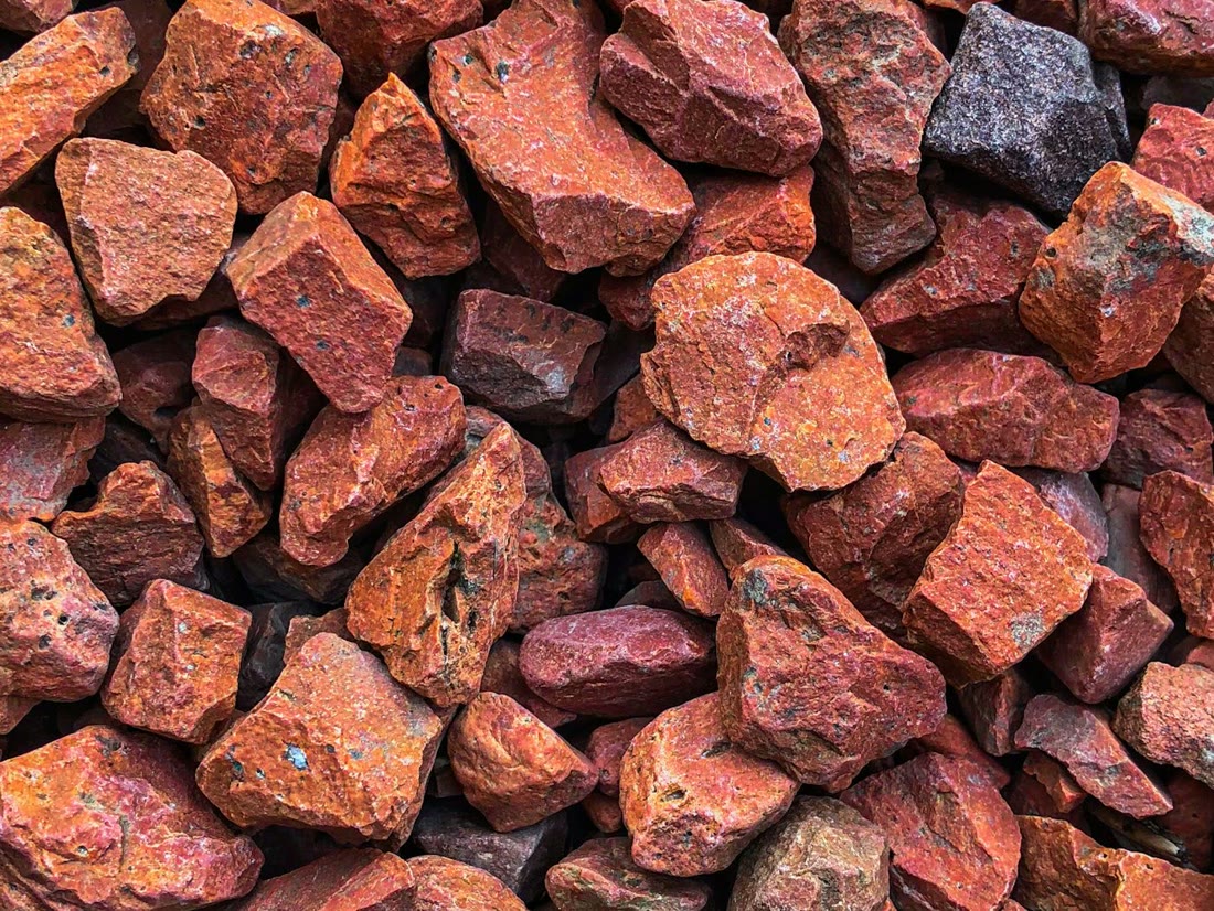 Pile of rust-red iron ore lumps